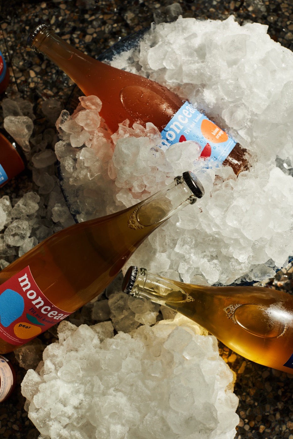 Bottles of Monceau buried in crushed ice, wrapped in red fragile tape